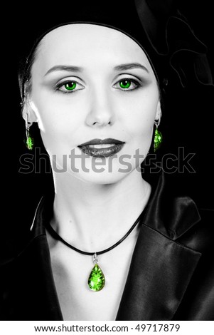 Old-fashioned lady. Green eyes. On black background.