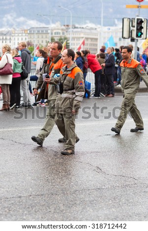 March 3, 2015 Marathon harmony in Geneva, Switzerland. people of different professions provide job marathon. assistance service, police, firefighters