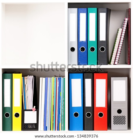File folders, standing on the shelves at office