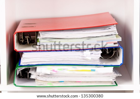Close-up of file folders on the shelves at office