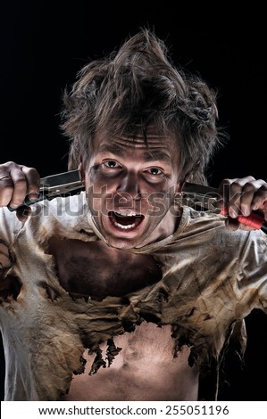 Portrait of crazy electrician over black background