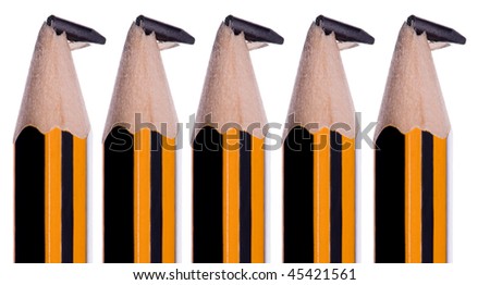 Close-up image of broken pencils isolated on white background