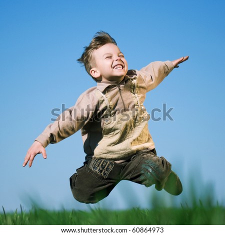 Happy Little Boy Jumping In Field Against Blue Sky Stock Photo 60864973 ...