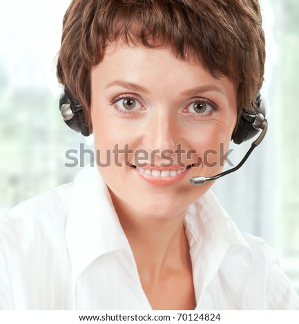 Portrait of a friendly woman with headset at her office