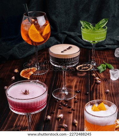 Similar – Image, Stock Photo Fresh colorful exotic alcoholic cocktail with orange and rosemary on the bar desk. Tasty Soft drink with fruits. selective focus