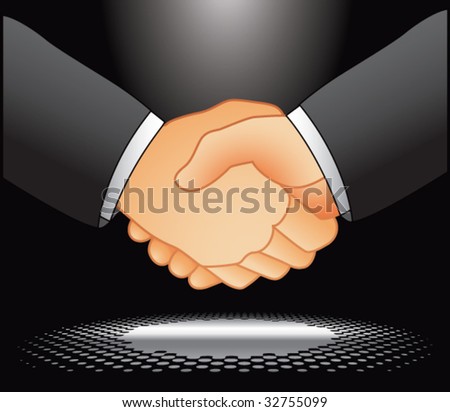 business handshake under spotlight