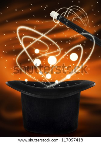 Magic hat with wand for magic show on orange background