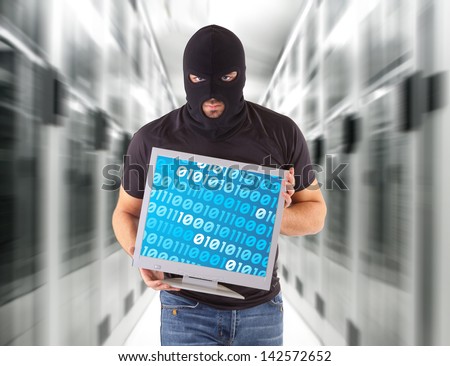 Hacker with balaclava and monitor