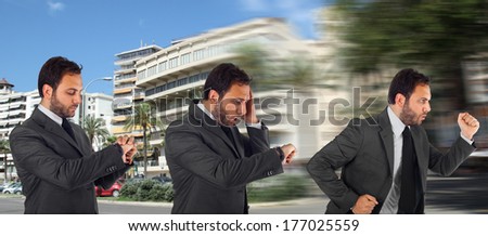 Young businessman running in office because it is late