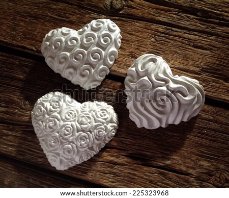 Hearts of plaster on wooden table