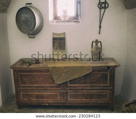 Old wooden chest of drawers in the Trullo Sovrano in Alberobello.