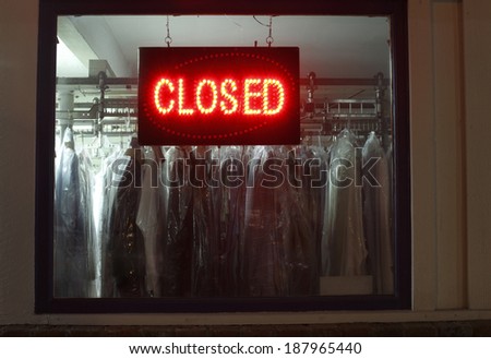 Closed sign in dry cleaners window