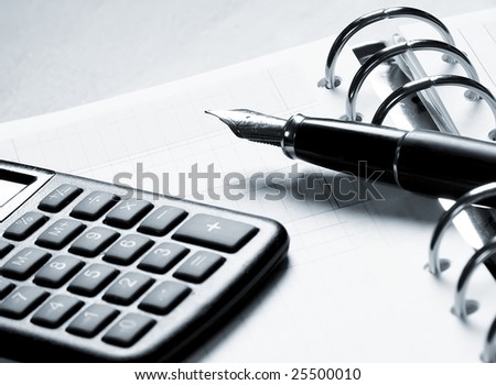 fountain pen, calculator and agenda