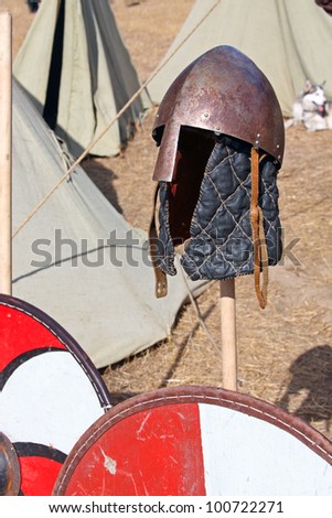 Ancient Scandinavian helmet and shield. Medieval armor pieces