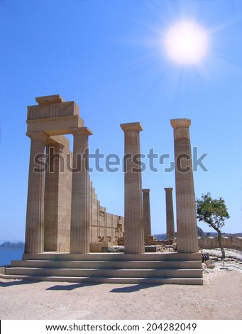 Ruins of ancient Greek temple with columns in summer day. Lindos, Rhodes