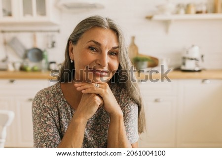 Similar – Image, Stock Photo Attractive Mature woman having headache. Hands on temples.