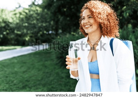 Similar – Image, Stock Photo Content sportswoman with water bottle taking selfie on smartphone