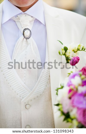 Close-up of elegance groom suit and tie