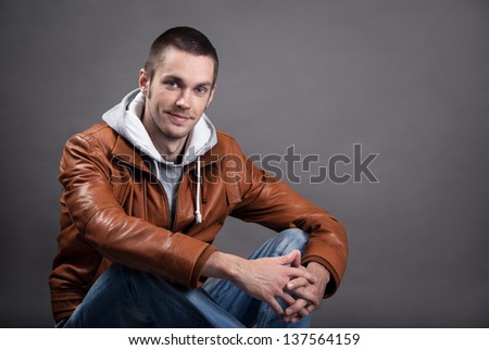 Portrait of a good looking man in classic leather jacket