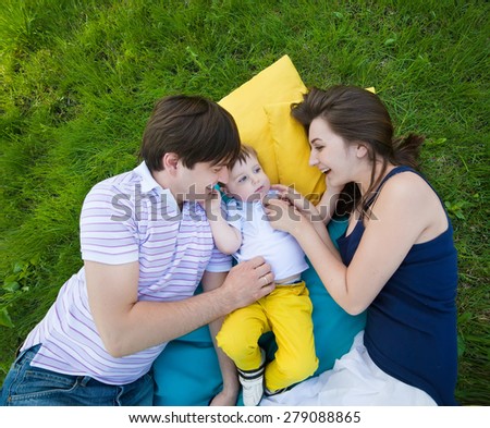 happy family on a blanket in the garden