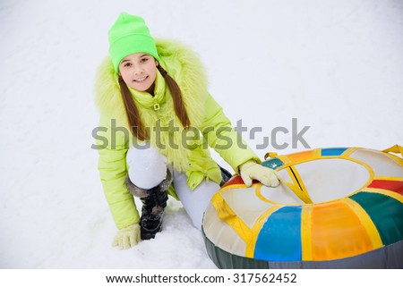 Girl on a Snow Tube Winter Activity