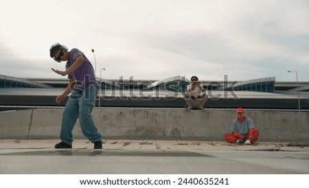 Similar – Image, Stock Photo Skillful break dancer performing handstand while moving