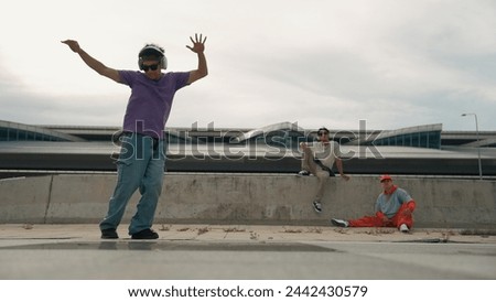 Similar – Image, Stock Photo Skillful break dancer performing handstand while moving