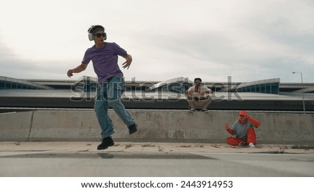 Similar – Image, Stock Photo Skillful break dancer performing handstand while moving