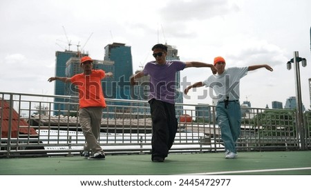 Similar – Image, Stock Photo Skillful break dancer performing handstand while moving