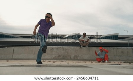 Similar – Image, Stock Photo Skillful break dancer performing handstand while moving