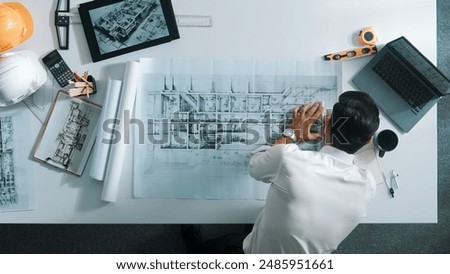 Similar – Image, Stock Photo Architects working material in the foreground, in the background a blurred employee in front of the monitor