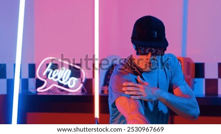 Similar – Image, Stock Photo Skillful break dancer performing handstand while moving