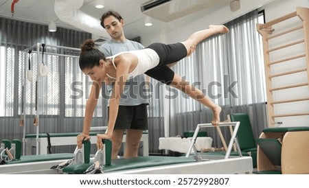 Similar – Image, Stock Photo Flexible woman doing side bend and practicing yoga