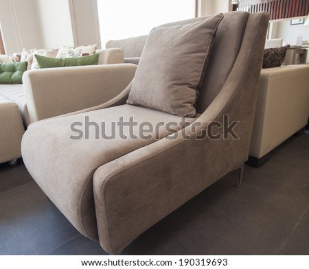 Brown sofa chair seat in living room furniture show room