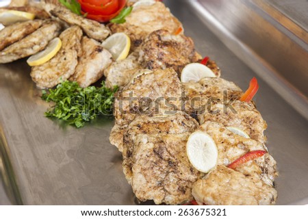 Grilled fish with egg panne on display at hotel restaurant buffet