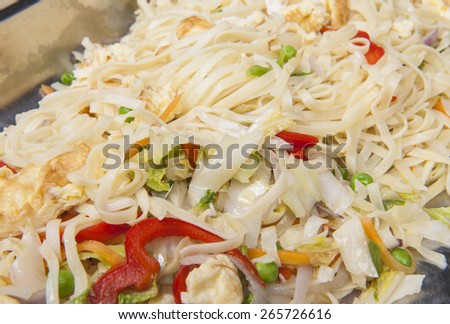 Closeup of chinese egg fried noodles meal on display at a hotel restaurant buffet