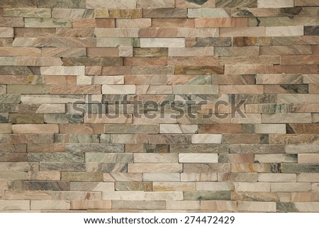 Fake stone brick wall facade inside apartment interior creating background wallpaper