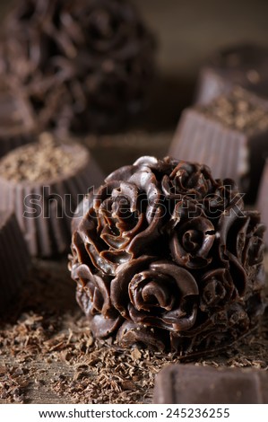 Homemade natural chocolate candies with chips close-up.