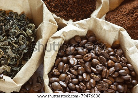 Close-up of assorted coffee and green tea in paper bags.