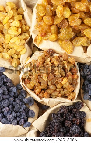 Various raisins in paper bags. Top view point.
