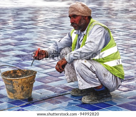 DUBAI, UAE - FEBRUARY 12: Construction worker in Dubai. A general image of a worker in his deep thoughts in a construction site in Dubai on 12th Feb 2012.