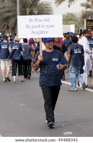 DUBAI - UAE - APRIL 06 2012: Unidentified person with a placard during the \