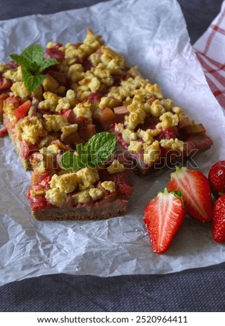 Similar – Image, Stock Photo Fresh strawberries and rhubarb on wooden table background with ingredients for tasty seasonal cooking or baking. Top view. Healthy clean food. Paleo dieting. Home cuisine. Garden fruits eating