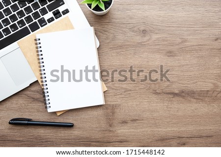 Similar – Image, Stock Photo Desk with laptop, notebook, pen in foreground