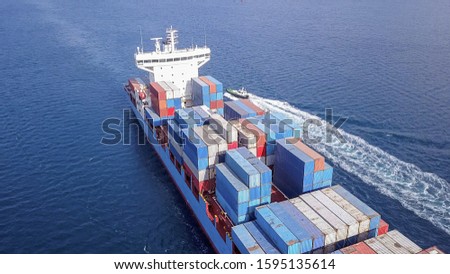Large container ship at sea, loaded with various container brands. ULCV container ship sails on open water fully loaded with containers and cargo. Zdjęcia stock © 