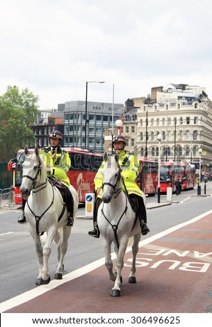 London/United Kingdom - 07/06/2012 - Two British Metropolitan Police Officers riding on Horseback in June