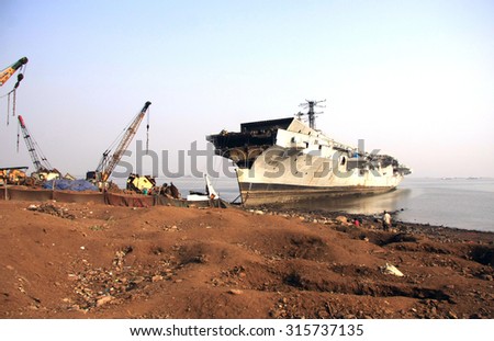 Mumbai/India - 23/11/14 - INS Vikrant beached in Darukhana Ship Breaking Yard with a small portion of its bow sliced away.