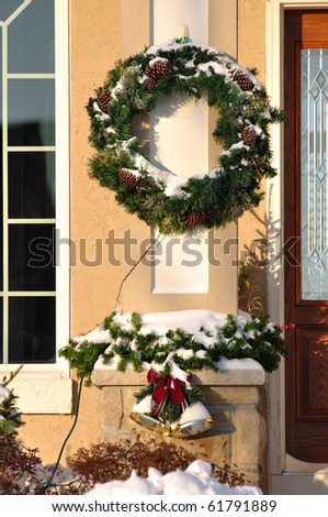 Christmas Wreath, Garland and Bells Covered with Snow