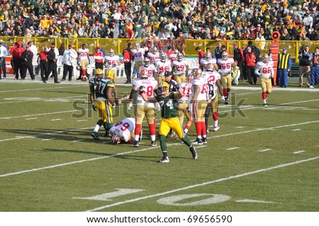 GREEN BAY, WI - NOVEMBER 22 : Aaron Kampman of the Green Bay Packers Defense Celebrates in a game at Lambeau Field against the San Francisco 49ers on November 22, 2009 in Green Bay, WI