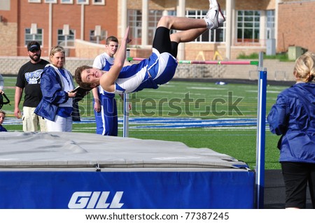 SPRING LAKE PARK, MN - May 7: Unidentified Teen Boy Doing the High Jump at a High School Track and Field Meet on May 7, 2010 in Spring Lake Park, Minnesota.